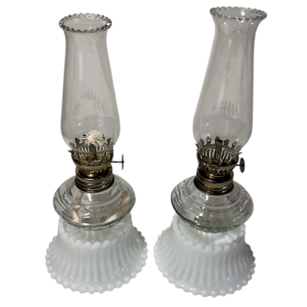 miniature antique milk glass and clear glass oil lamp with a ruffled edge